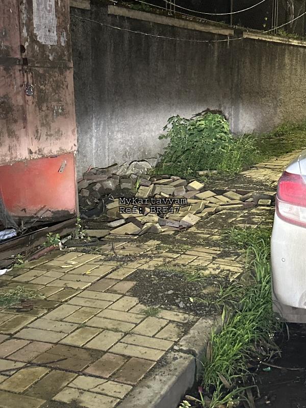 Broken footpath with all block tiles dumped